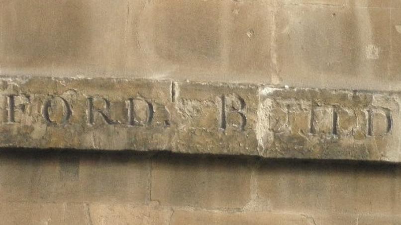 Axfords Buildings sign before restoration