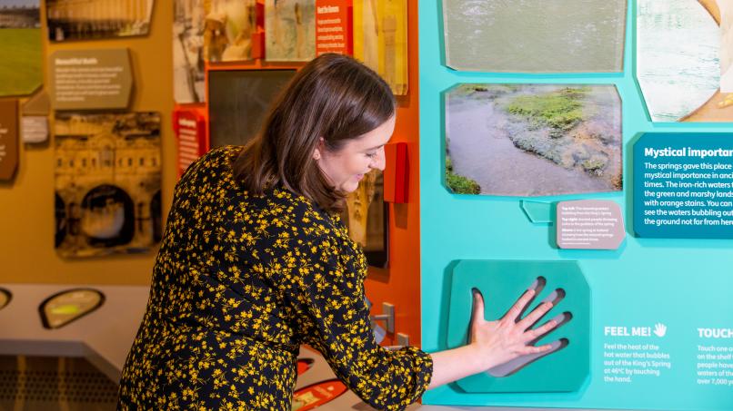 Image: A visitor trying out an interactive display